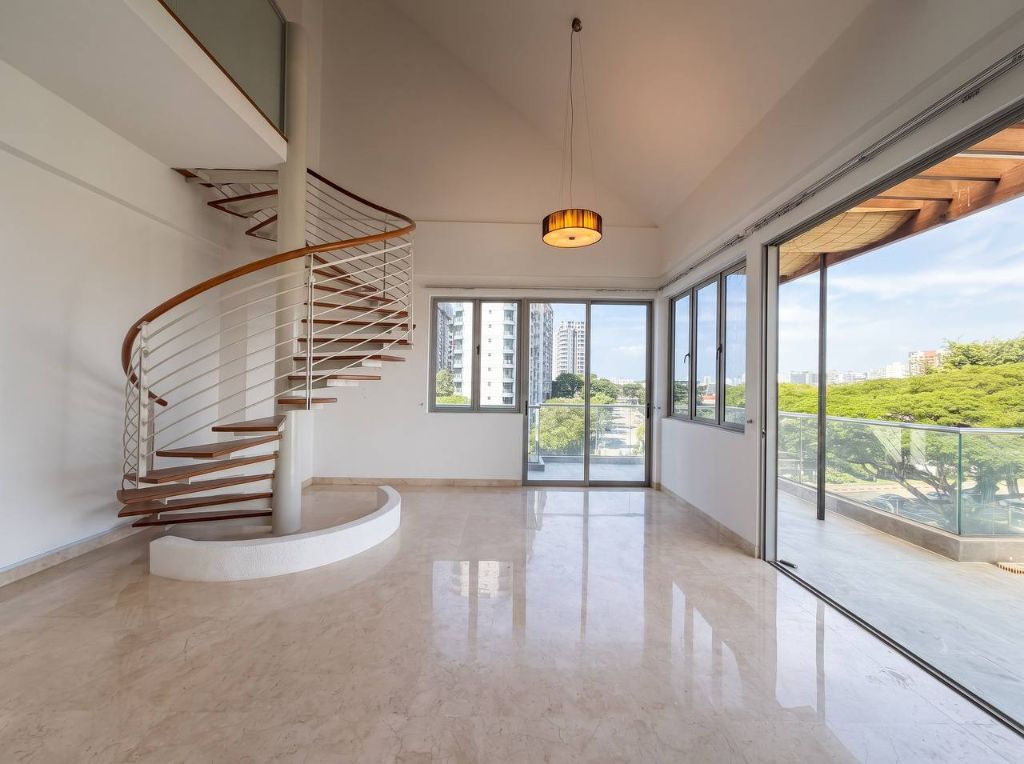Interior of the Dunman duplex penthouse with a spiral staircase, double-height ceiling and floor-to-ceiling balcony doors